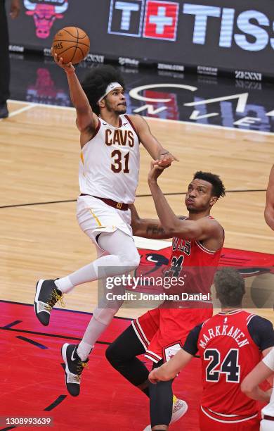 Jarrett Allen of the Cleveland Cavaliers goes up for a shot over Wendell Carter Jr. #34 of the Chicago Bulls at the United Center on March 24, 2021...