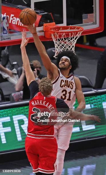 Jarrett Allen of the Cleveland Cavaliers blocks a shot by Lauri Markkanen of the Chicago Bulls at the United Center on March 24, 2021 in Chicago,...