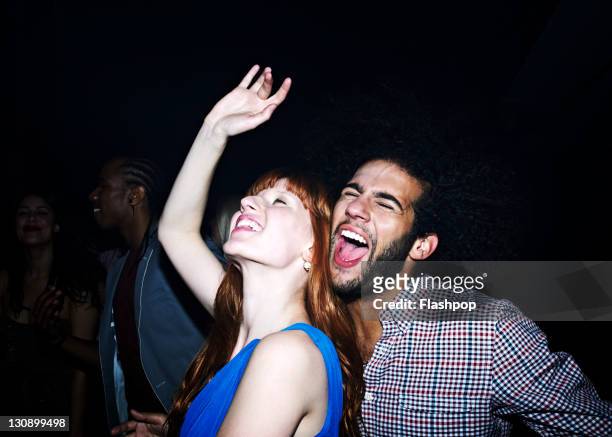 group of people dancing at nightclub - couple shouting stock pictures, royalty-free photos & images