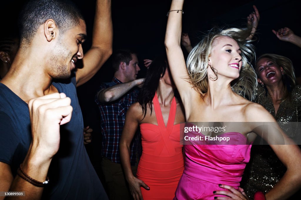 Group of people dancing at nightclub