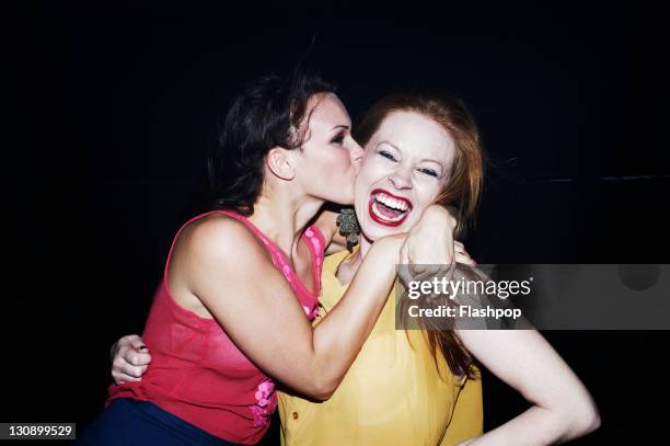 two women having fun together on night out - lesbians kissing stock pictures, royalty-free photos & images