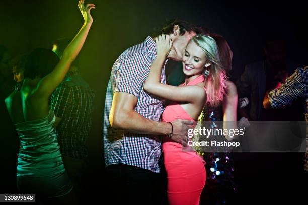 couple dancing, getting close on the dance floor - flirting stockfoto's en -beelden