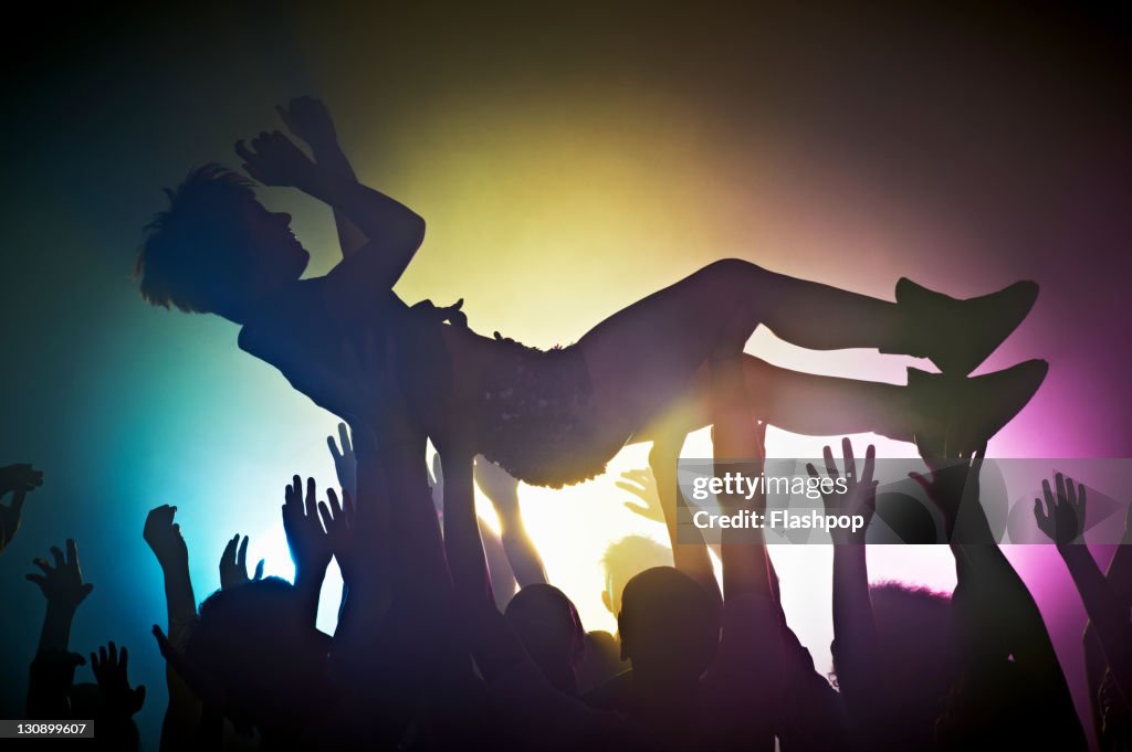 Woman crowd surfing