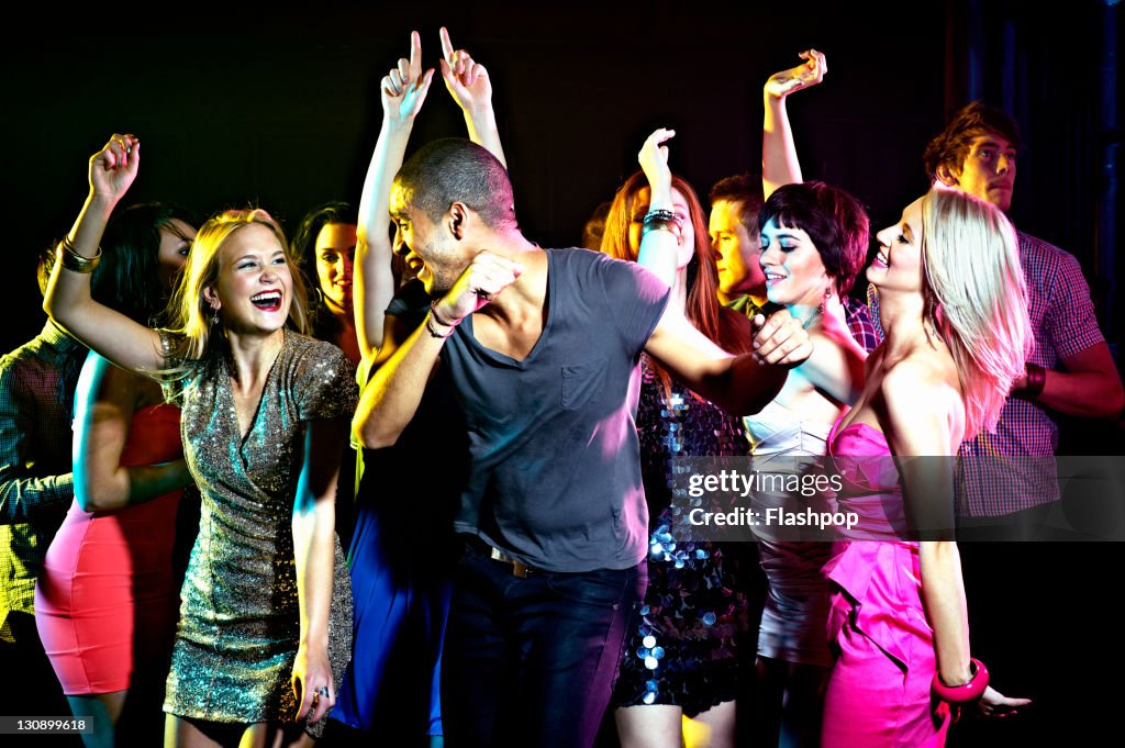 Group of people dancing at nightclub