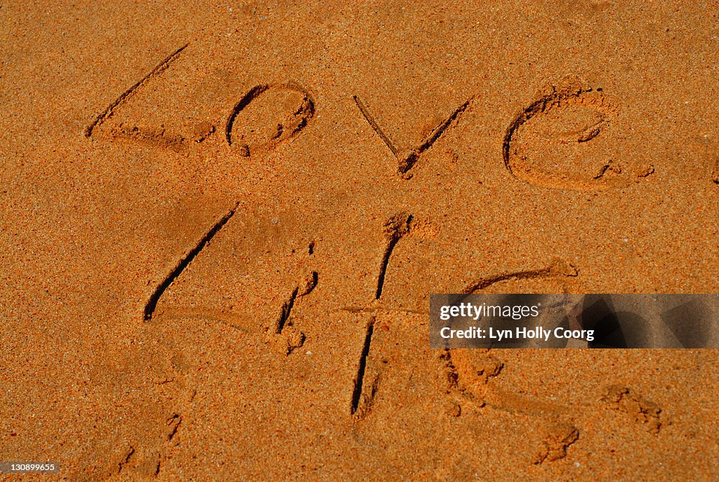 'Love Life' written in Sand