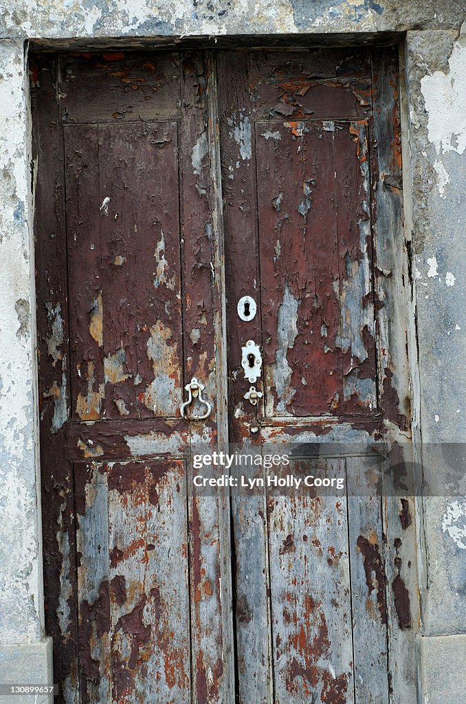 Old wooden door with peeling paint