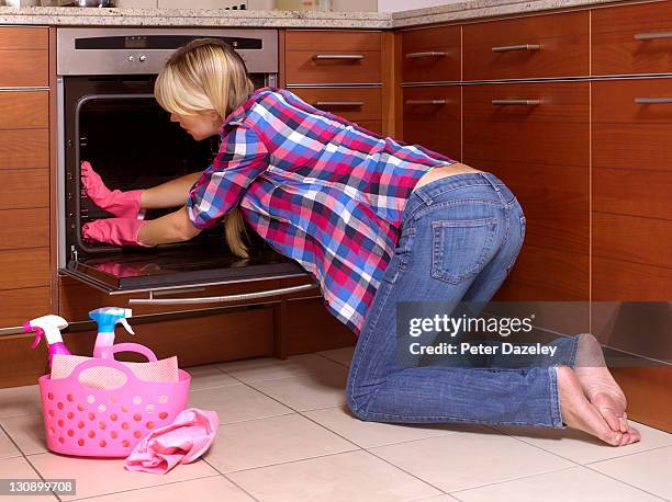 girl cleaning out kitchen oven - clean oven stock pictures, royalty-free photos & images