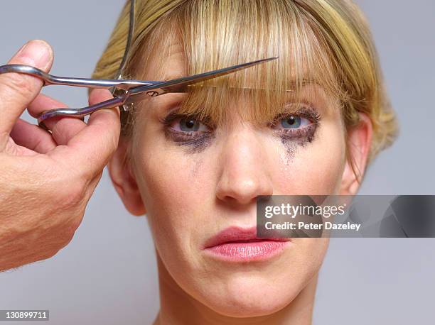 unhappy girl at hairdressers - pony haardracht stockfoto's en -beelden