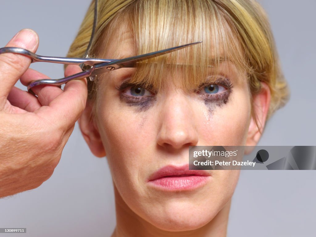 Unhappy girl at hairdressers