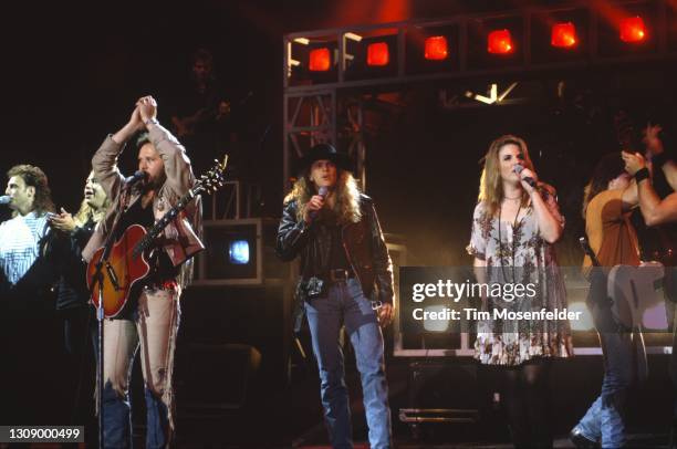 Travis Tritt, Tim Rushlow of Little Texas, and Trisha Yearwood perform at Shoreline Amphitheatre on August 22, 1993 in Mountain View, California.