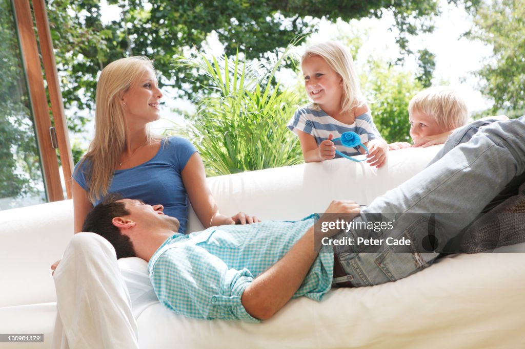 Family around sofa