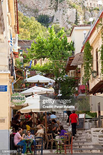 taverna, cafe below acropolis, plaka, athens - plaka stock pictures, royalty-free photos & images