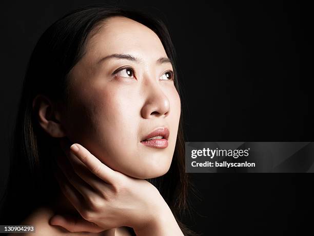 young asian woman on black background. - 937462 foto e immagini stock