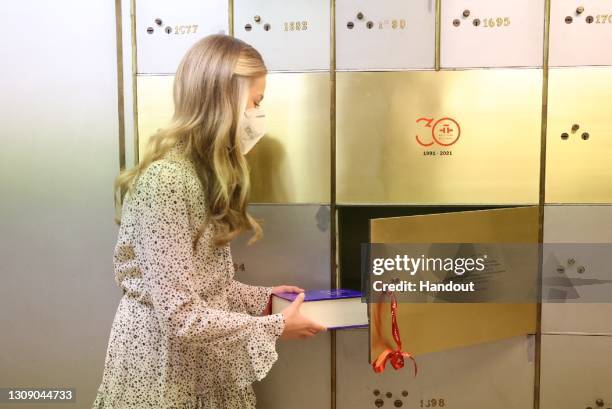 This handout image provided by the Spanish Royal Household shows Princess Leonor, as she deposits the copies of the Constitution and the Quixote in...