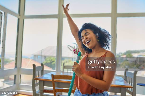 making chores more joyful - woman dancing stock pictures, royalty-free photos & images