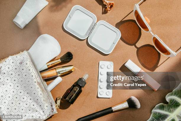 top view makeup bag with beauty items around - pink vanity stock pictures, royalty-free photos & images