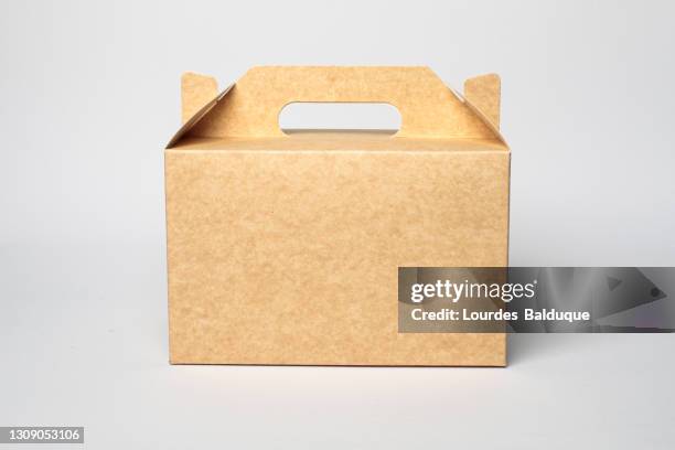 paper container, brown carton on white background. recyclable packaging - meal fotografías e imágenes de stock