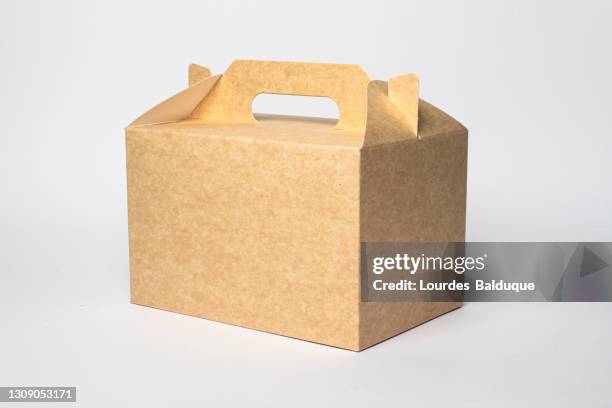 paper container, brown carton on white background. recyclable packaging - food close up stock pictures, royalty-free photos & images