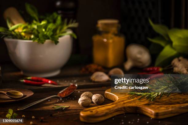 aromatic herbs and spices on a rustic wooden table - allspice stock pictures, royalty-free photos & images