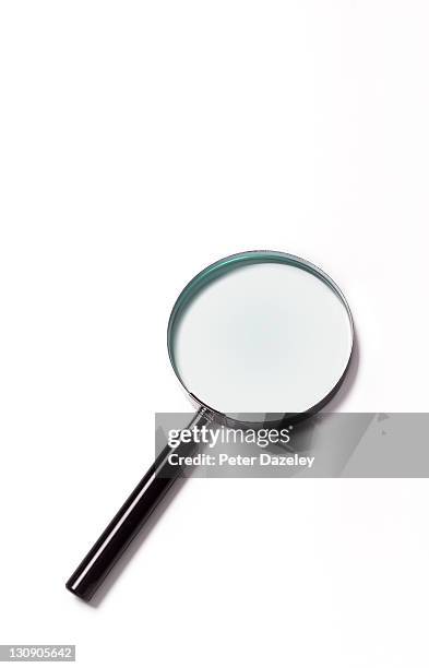 close up of magnifying glass with copy space - vergrößerungsglas stock-fotos und bilder