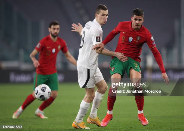 Andre Silva of Portugal clashes with Anton Krivotsyuk of Azerbaijan during the FIFA World Cup 2022 Qatar qualifying match between Portugal and...