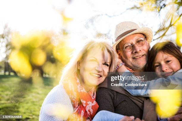 mature couple with granddaughter - autumn czech republic stock pictures, royalty-free photos & images