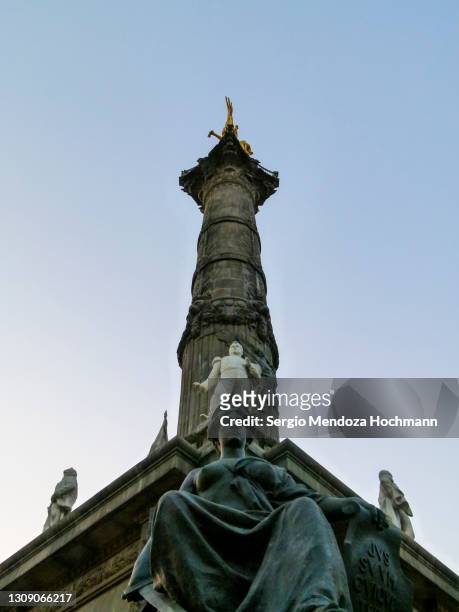 low angle view of the angel of independence monument in mexico city, mexico - mexico city street stock pictures, royalty-free photos & images