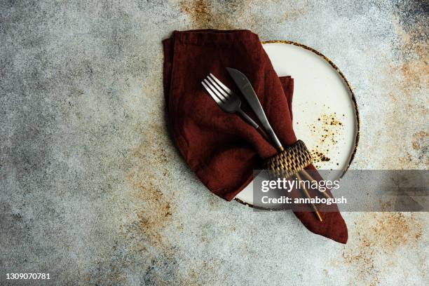 overhead view of a rustic place setting on a table - napkin ring stock pictures, royalty-free photos & images