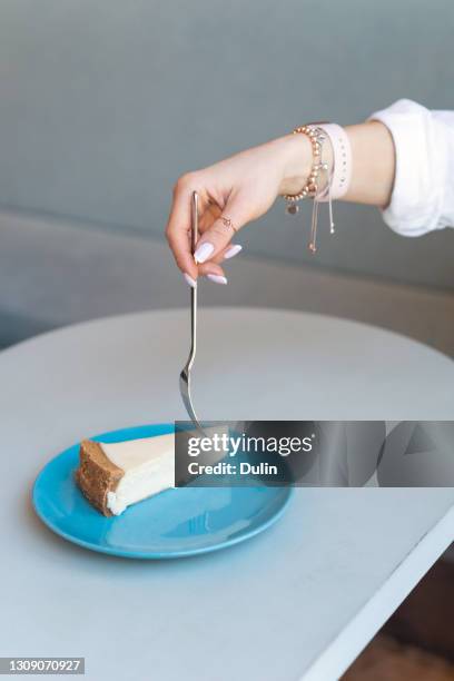 woman about to eat a slice of cheesecake - french nails stock pictures, royalty-free photos & images