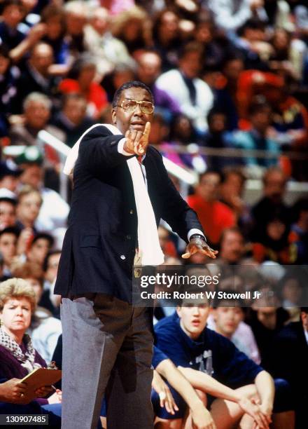 Georgetown coach John Thompson works the sidelines during a game against the University of Connecticut, Hartford, Connecticut, 1990.