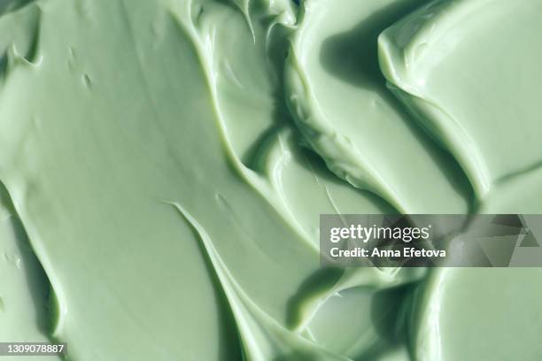 texture of pastel turquoise cream. herbal medicine and alternative therapy concept. selfcare is a trend of the year. cosmetics banner with copy space - green room stockfoto's en -beelden