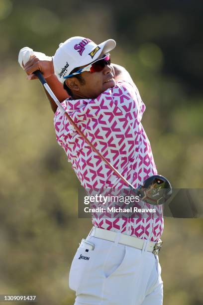 Hideki Matsuyama of Japan plays his shot on the third tee in his match against Brian Harman of the United States during the second round of the World...