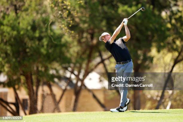 Justin Thomas of the United States plays his shot on the sixth hole in his match against Kevin Kisner of the United States during the second round of...