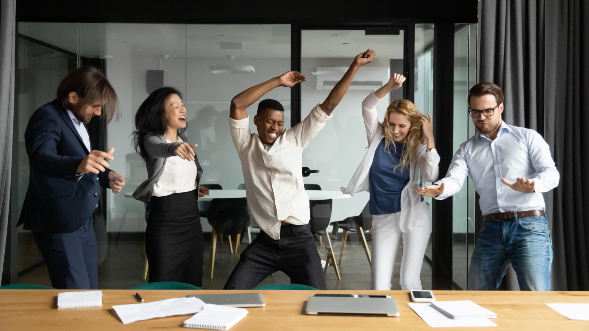 Crazy emotional multiracial business people having fun in office. Crazy emotional multiracial business people having fun in office.