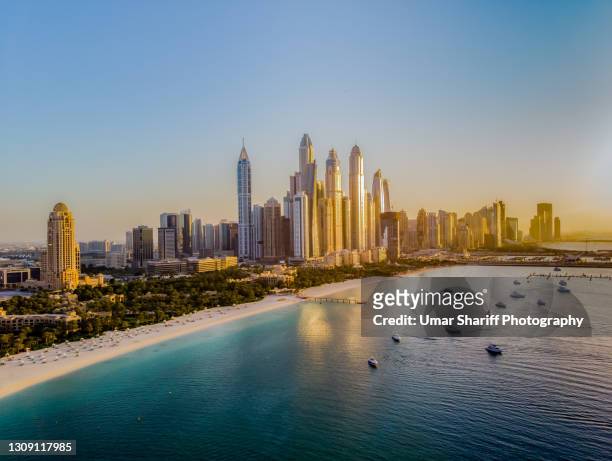 dubai marina from the sea side during sunset - expo 2020 dubai stock pictures, royalty-free photos & images