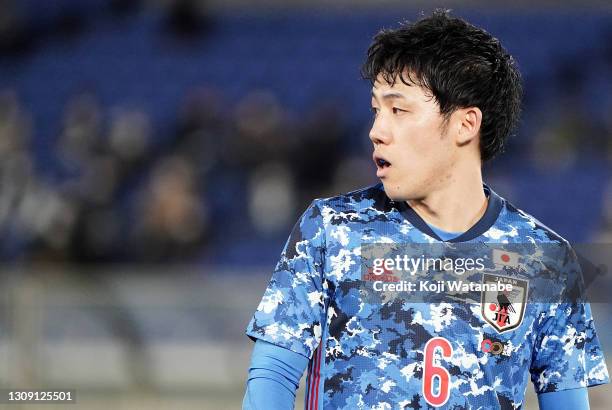 Wataru Endo of Japan looks on during the international friendly match between Japan and South Korea at the Nissan Stadium on March 25, 2021 in...