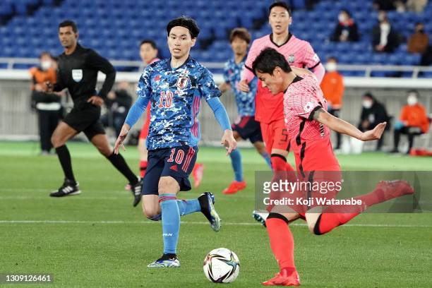Takumi Minamino of Japan in action during the international friendly match between Japan and South Korea at the Nissan Stadium on March 25, 2021 in...