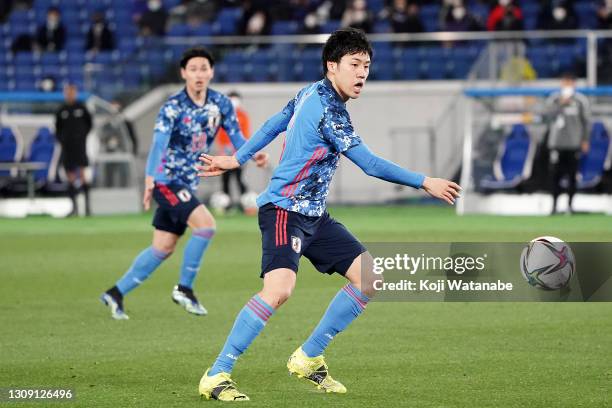 Wataru Endo of Japan in action during the international friendly match between Japan and South Korea at the Nissan Stadium on March 25, 2021 in...