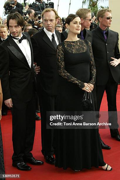 Keanu Reeves, Hugo Weaving, and Carrie-Anne Moss during 2003 Cannes Film Festival - The Matrix Reloaded Premiere at Palais des Festivals in Cannes,...