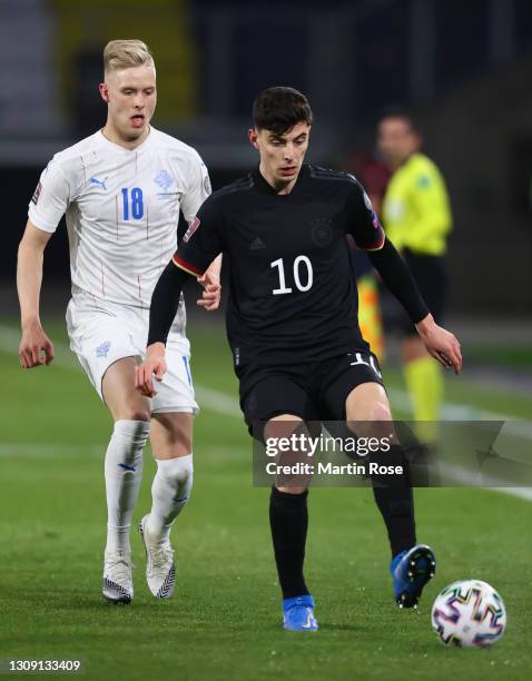 Kai Havertz of Germany battles for possession with Hordur Magnusson of Iceland during the FIFA World Cup 2022 Qatar qualifying match between Germany...