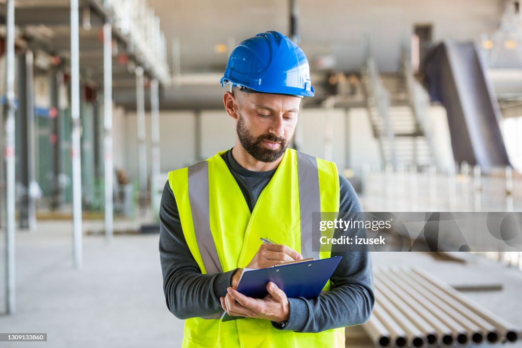 Electrician at an indoor construction site