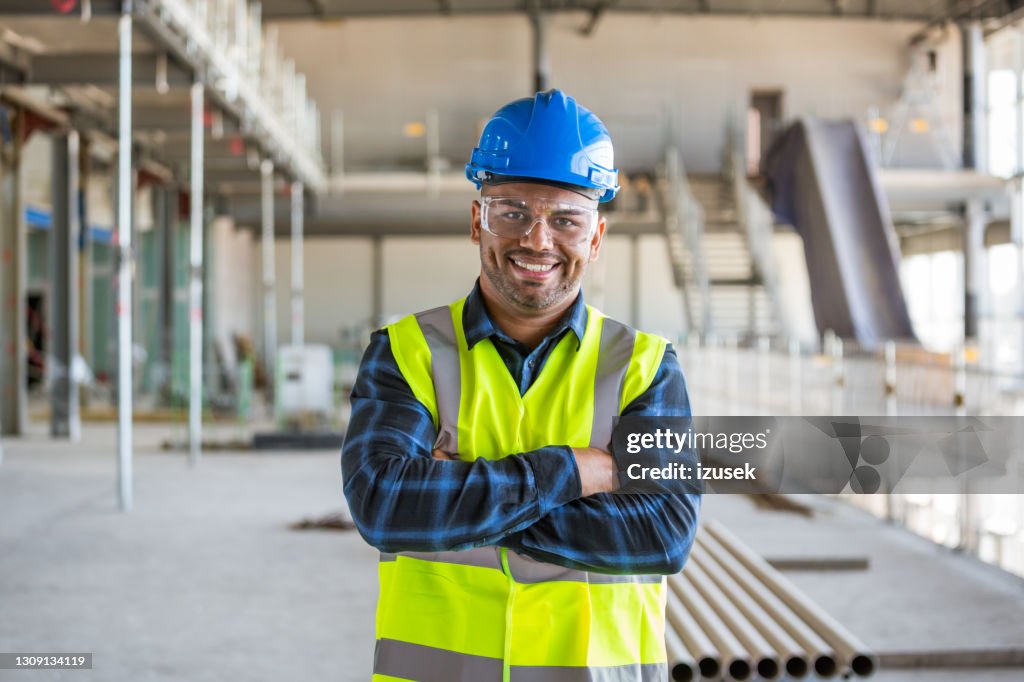 Electrician at an indoor construction site