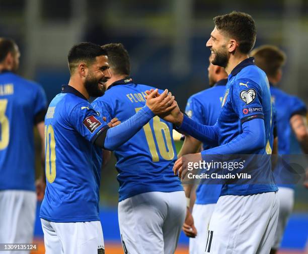 Domenico Berardi of Italy celebrates with teammate Lorenzo Insigne after scoring the opening goal during the FIFA World Cup 2022 Qatar qualifying...