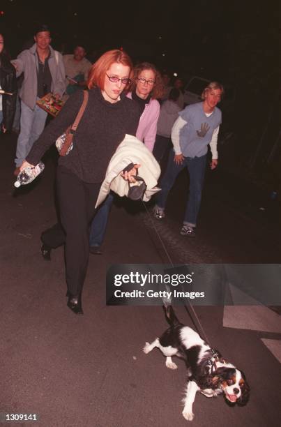 Files" star Gillian Anderson with her dog Happy at Comic Relief''s third annual A Cracked Christmas benefitting The Trevor Project December 3, 2000...