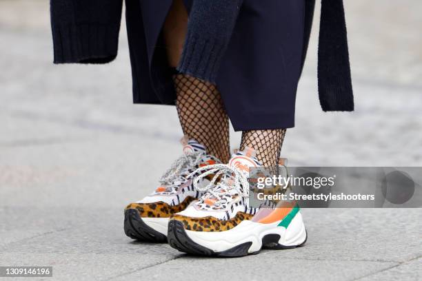 Multicolored sneaker with leopard print detail by Buffalo as a detail of Model and DJane Gitta Saxx during a street style shooting on March 25, 2021...