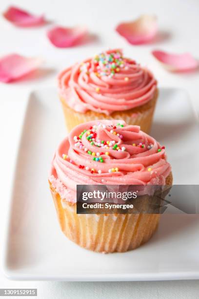 pink cupcakes with sprinkles - cupcake stock pictures, royalty-free photos & images