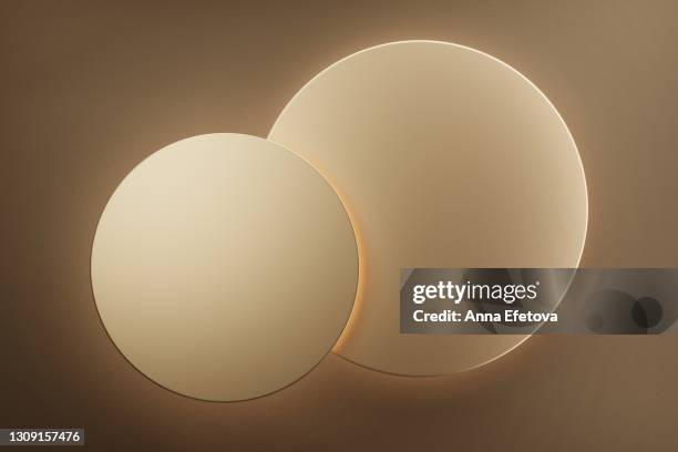 two golden podiums with luxury lightening. perfect stages for your product. flat lay style. three dimensional. trendy holiday colors and design style of the year - gold circle stock pictures, royalty-free photos & images