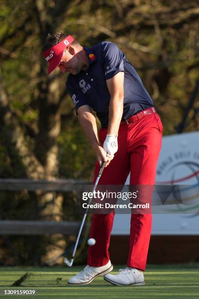 Ian Poulter of England plays his shot on the 18th tee in his match against Cameron Smith of Australia during the second round of the World Golf...