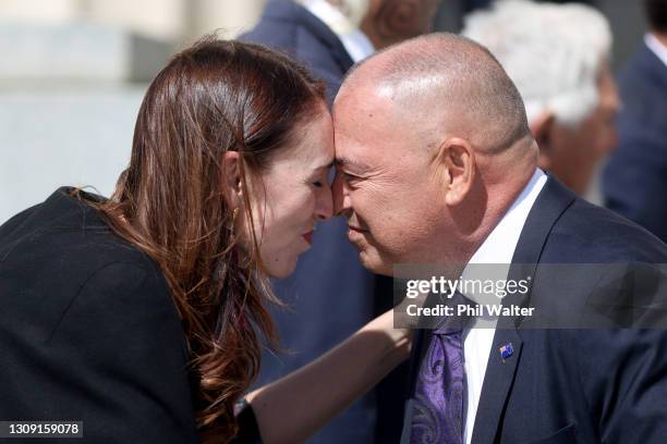 New Zealand Prime Minister Jacinda Ardern shares a hongi with Cook Islands Prime Minister Mark Brown during a powhiri at the Auckland War Memorial...