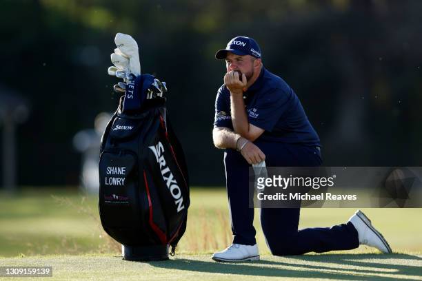 Shane Lowry of Ireland waits for his shot on the 16th hole in his match against Jon Rahm of Spain during the second round of the World Golf...